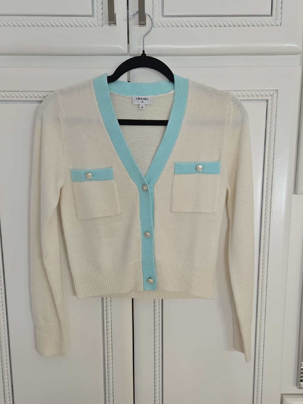 CHANEL Cream Cardigan with Light Blue Trim and Signature Buttons